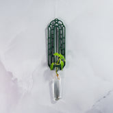 "Front view of FOREST GREEN Wall Propagation unit with thriving plant cutting displayed in the clear tube."